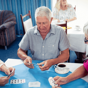 Seniors Playing Cards at Skilled Nursing Facility
